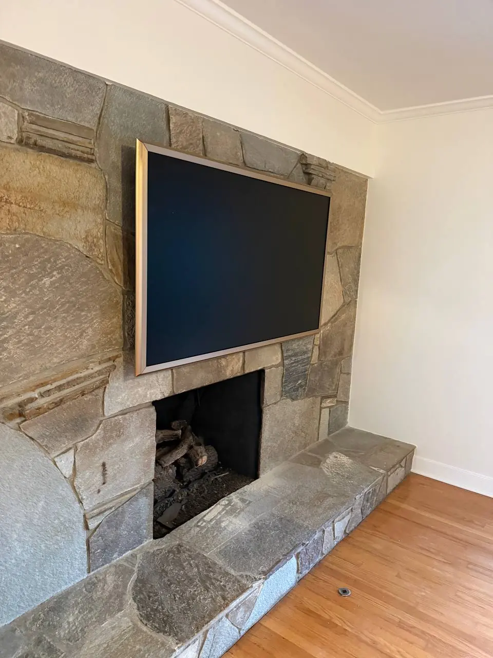 Completed television installation above a fireplace 2