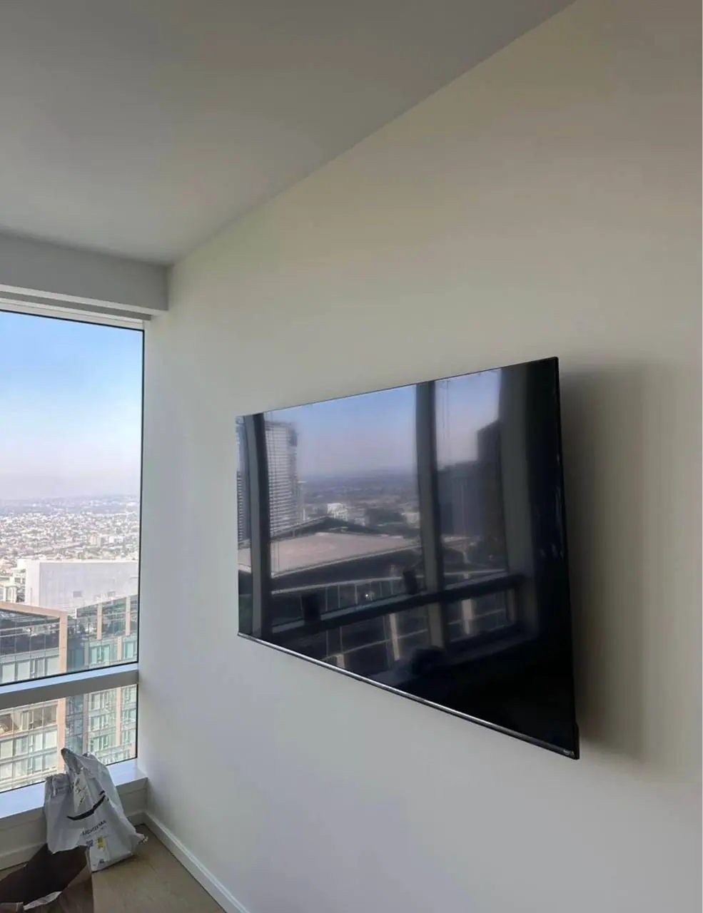 Wall-mounted television installation with cable concealment 1